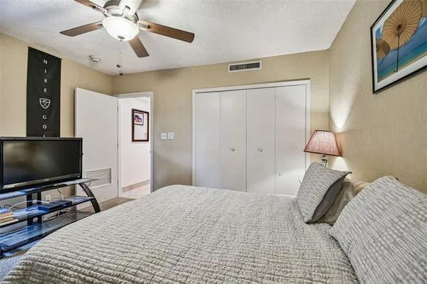 a bathroom with a sink mirror and a toilet