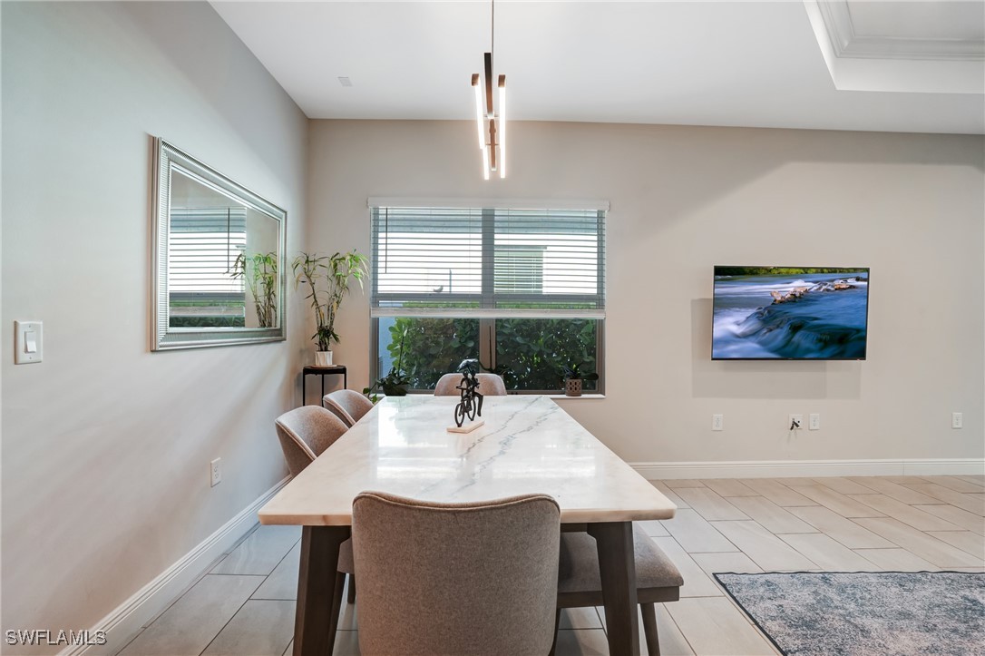 7028 Mistral Way Fort Myers, FL 33966 - Photo 14 of 37 a view of a dining room with furniture window and outside view