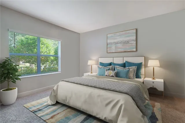 a spacious bedroom with a bed and window