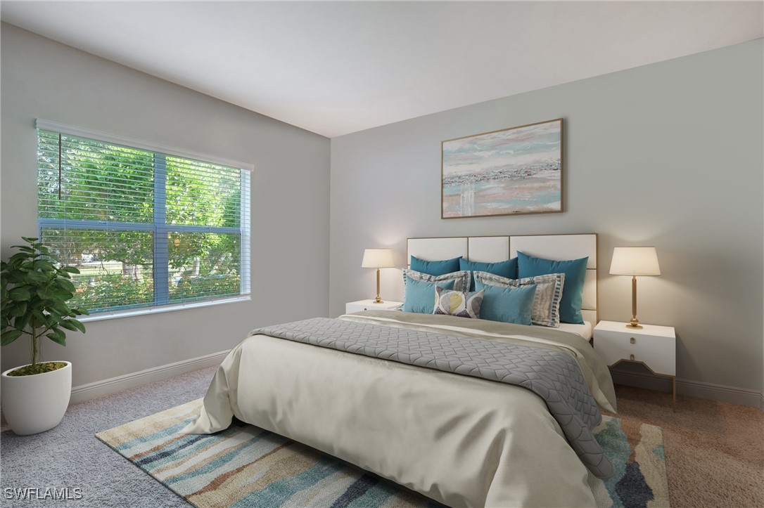 7028 Mistral Way Fort Myers, FL 33966 - Photo 15 of 37 a spacious bedroom with a bed and window