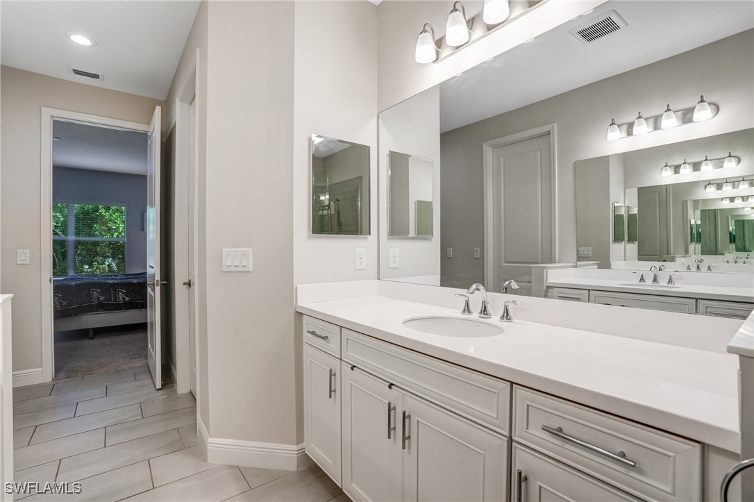 7028 Mistral Way Fort Myers, FL 33966 - Photo 16 of 37 a bathroom with a sink and a mirror