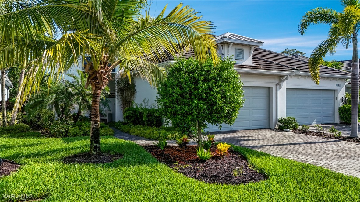 7028 Mistral Way Fort Myers, FL 33966 - Photo 2 of 37 a front view of a house with a yard
