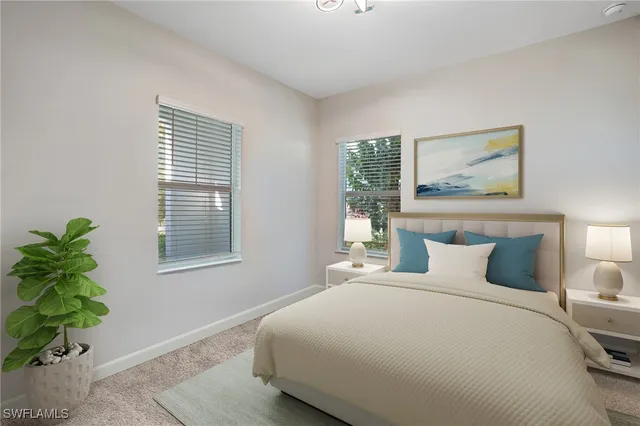 a bedroom with bed and a window