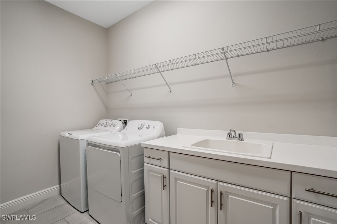 7028 Mistral Way Fort Myers, FL 33966 - Photo 22 of 37 a utility room with dryer and washer