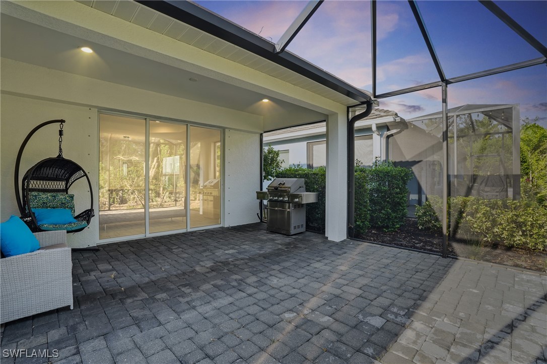7028 Mistral Way Fort Myers, FL 33966 - Photo 23 of 37 a view of a room with furniture and a yard