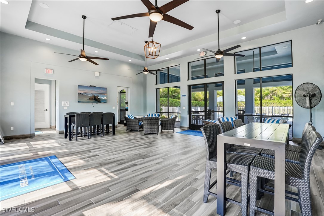 7028 Mistral Way Fort Myers, FL 33966 - Photo 26 of 37 a view of a dining room with furniture window and wooden floor