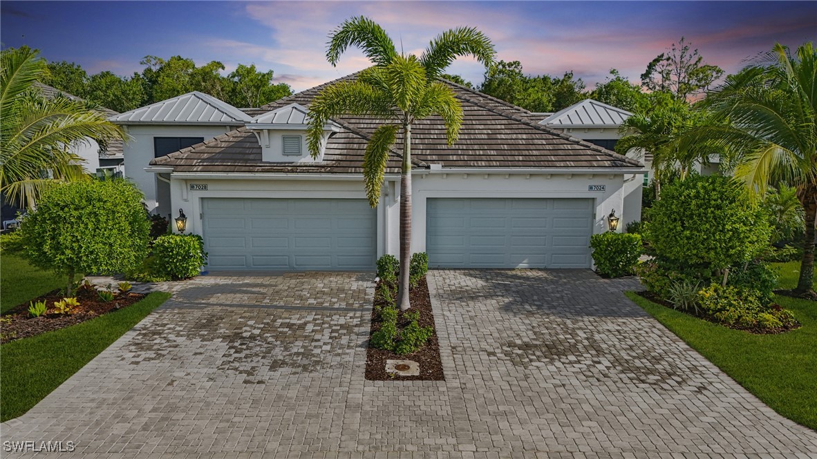 7028 Mistral Way Fort Myers, FL 33966 - Photo 4 of 37 front view of a house with a yard