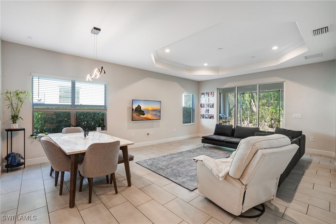 7028 Mistral Way Fort Myers, FL 33966 - Photo 7 of 37 a living room with furniture and a large window