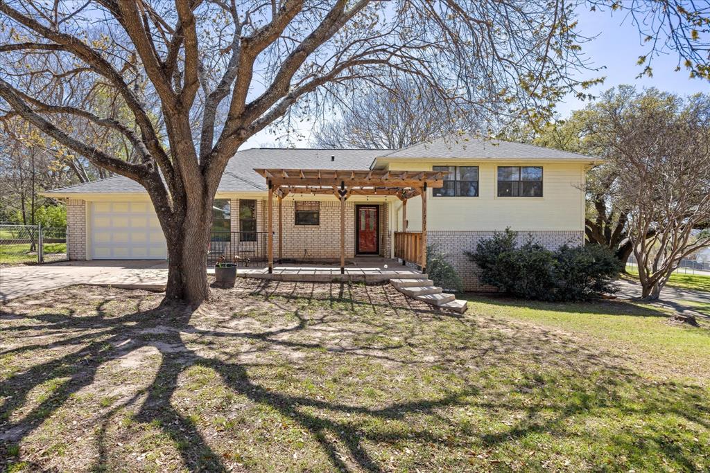 1701 Hitching Post Road Granbury, TX 76049 - Photo 1 of 37 Front patio with beautiful redwood pergola over the patio
