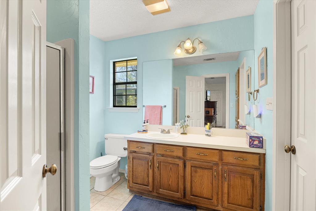1701 Hitching Post Road Granbury, TX 76049 - Photo 17 of 37 Ensuite for primary bedroom 1