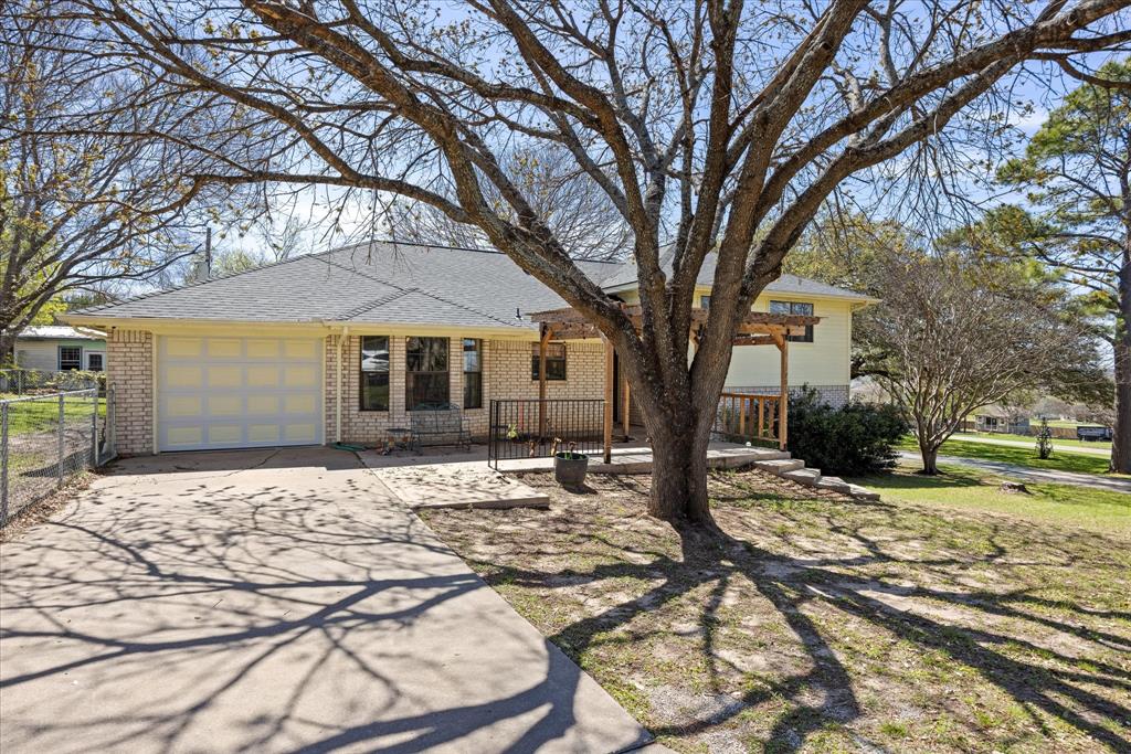 1701 Hitching Post Road Granbury, TX 76049 - Photo 2 of 37 This corner lot has beautiful, mature trees that will provide wonderful shade for you