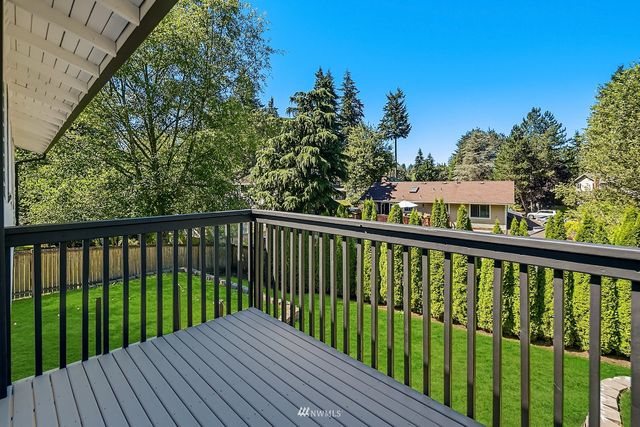 a view of balcony with wooden floor