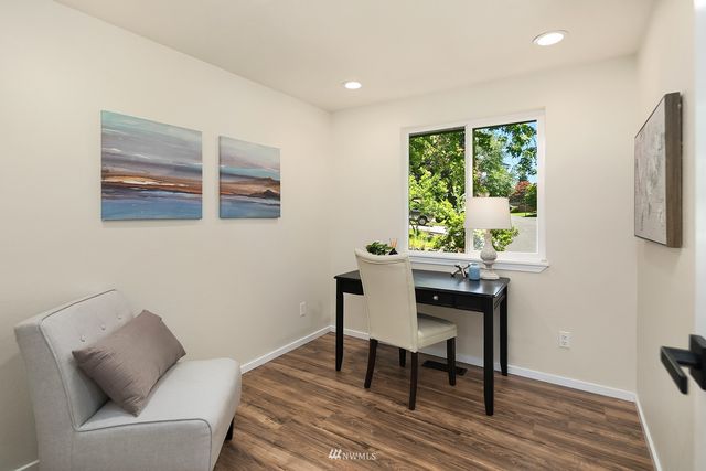 a workspace with furniture and window