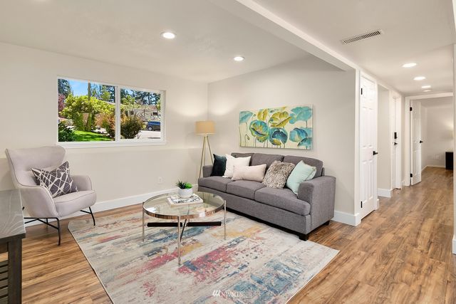 a living room with furniture and a rug