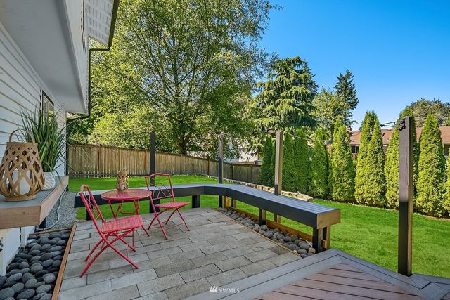 a park with a bench and trees in the roof