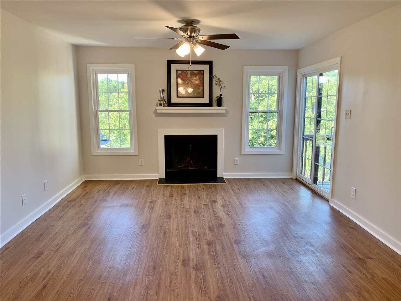 Fresh Neutral Paint! New Light Fixtures! Vinyl flooring. Living Room