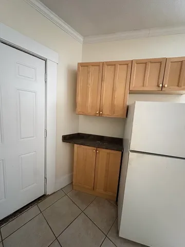 a view of bedroom with furniture and front door
