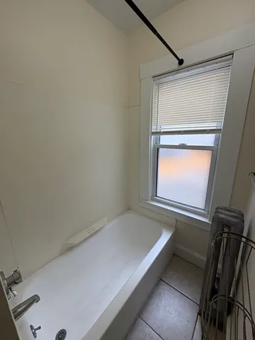 a view of an empty room and a window