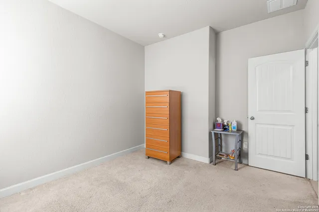a view of room with air conditioner and closet
