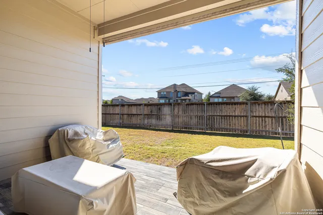 a view of a swimming pool with a lounge chair