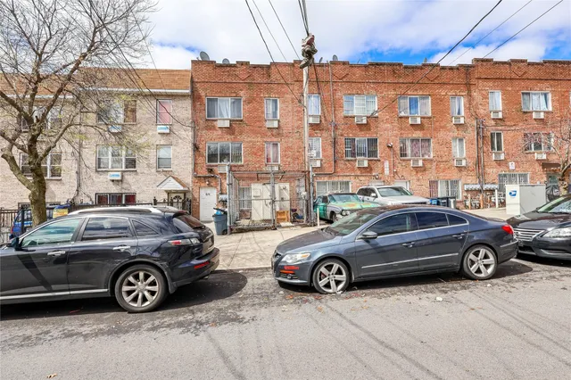 a view of a car parked in front of a building
