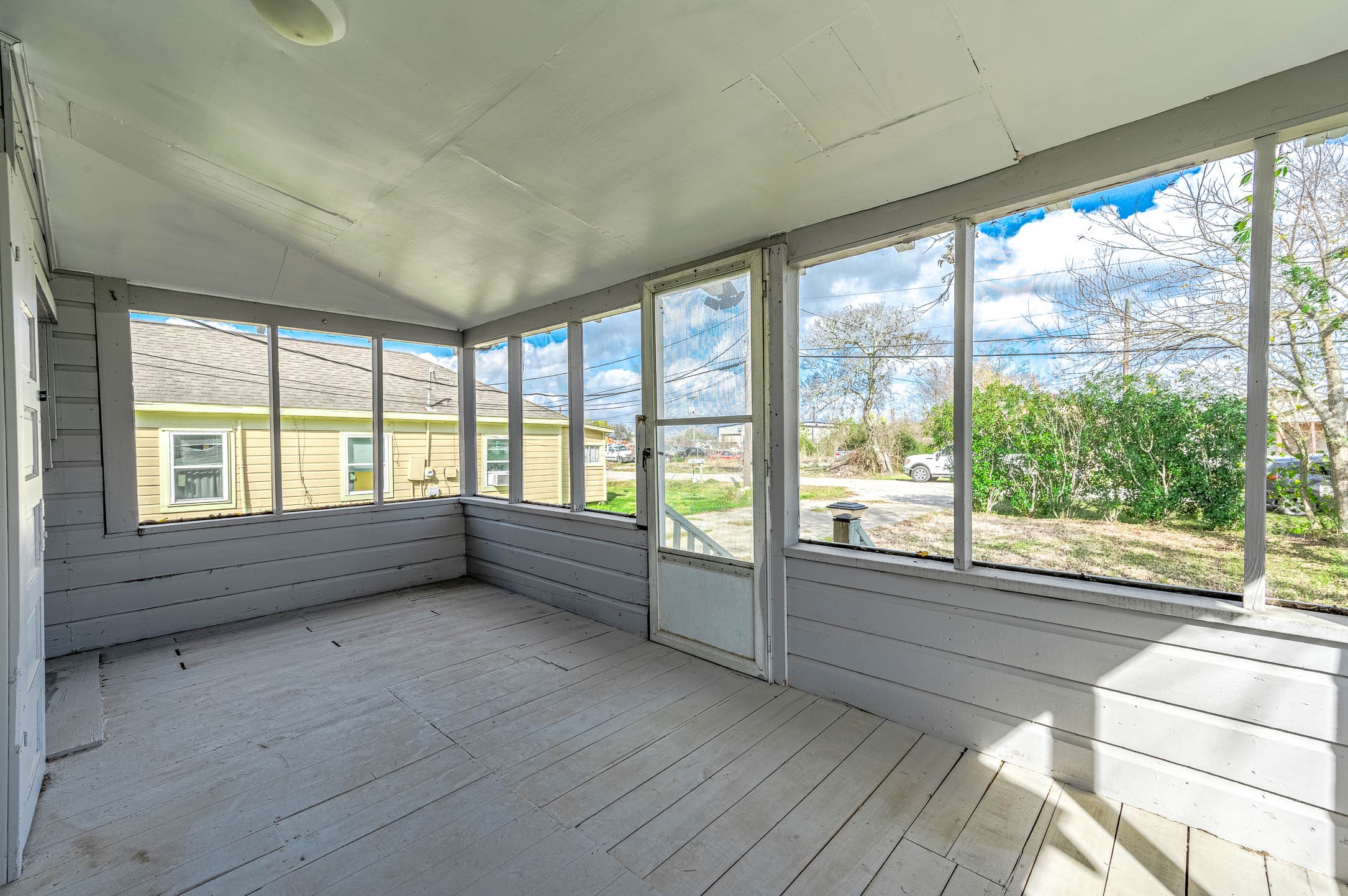 2012 Avenue F Dickinson, TX 77539 - Photo 4 of 20 a view of an empty room with wooden floor and a window