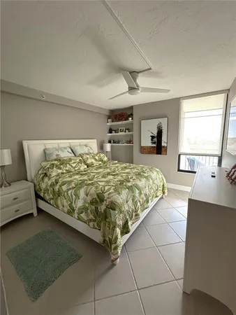 a bedroom with a large bed and a couch