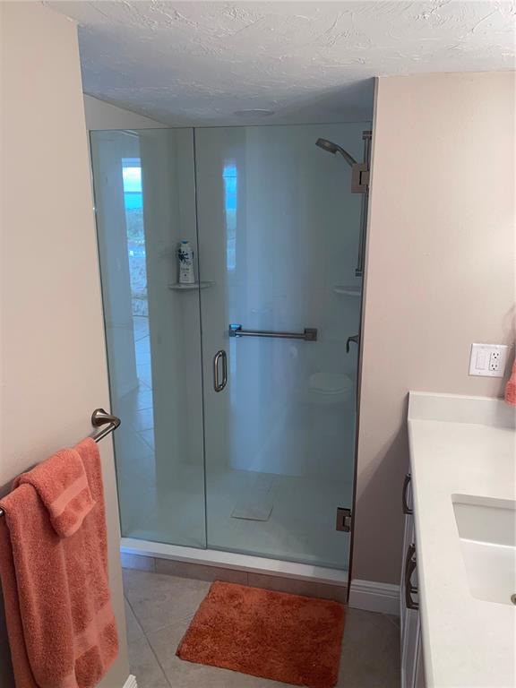 631 Alhambra Road, Unit 702 Venice, FL 34285 - Photo 14 of 14 a bathroom with a shower