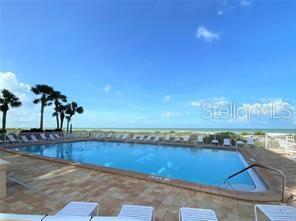 631 Alhambra Road, Unit 702 Venice, FL 34285 - Photo 2 of 14 a view of a swimming pool and an outdoor space