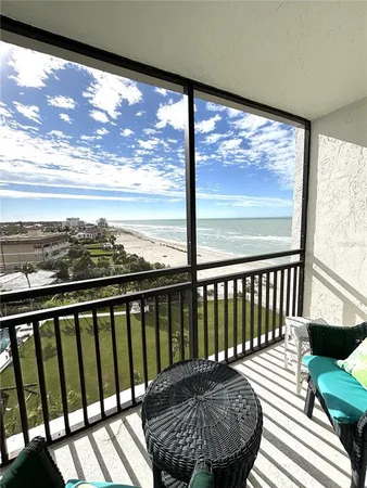 a view of balcony with wooden floor