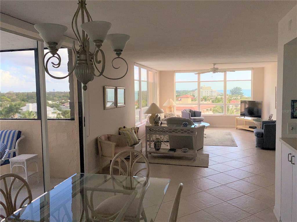 631 Alhambra Road, Unit 702 Venice, FL 34285 - Photo 5 of 14 a living room with furniture and a large window