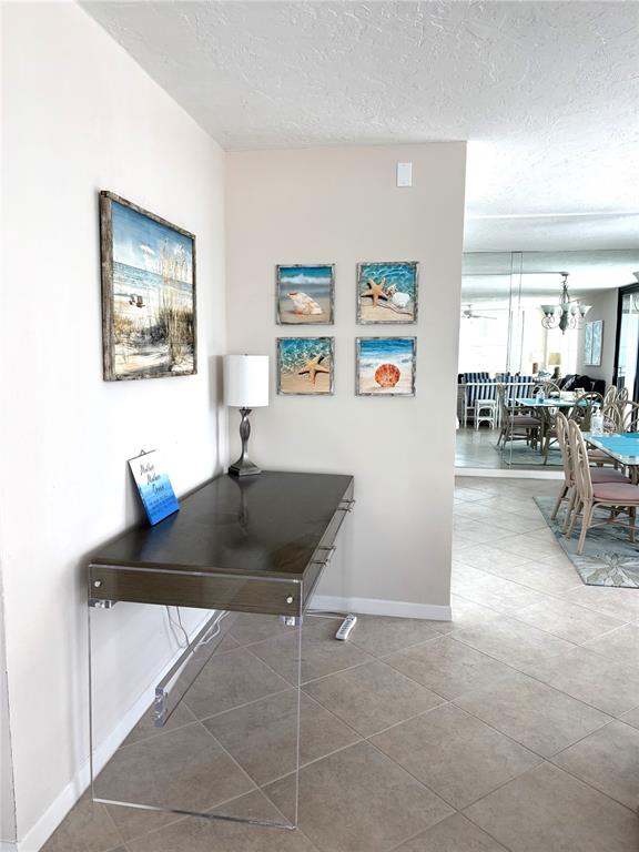 631 Alhambra Road, Unit 702 Venice, FL 34285 - Photo 8 of 14 a living room with furniture and window