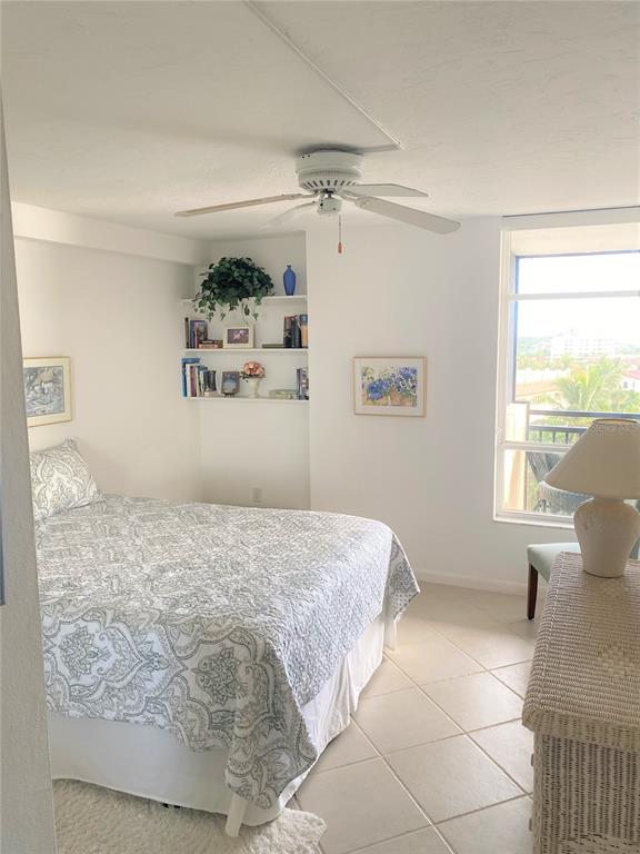 631 Alhambra Road, Unit 702 Venice, FL 34285 - Photo 9 of 14 a bedroom with a bed and window