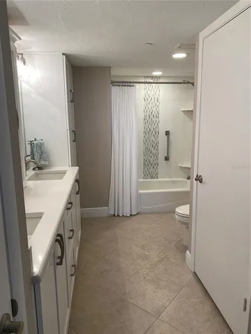 a bathroom with a sink a vanity and a mirror