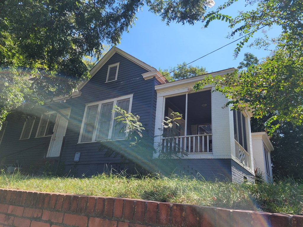 1226 18th Avenue, Unit A/B Columbus, GA 31906 - Photo 2 of 2 a front view of a house with a yard