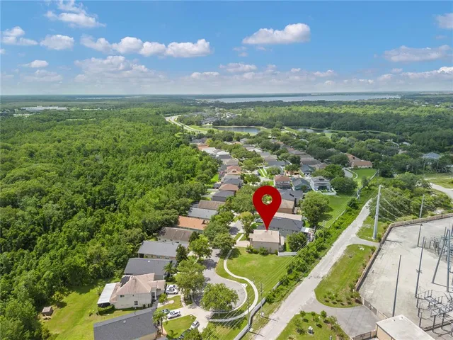 a view of a house with a yard and sitting area