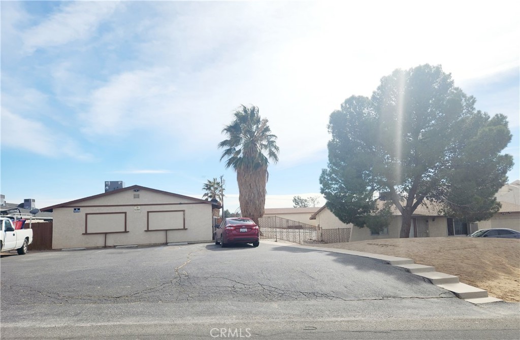 a view of a house with a street