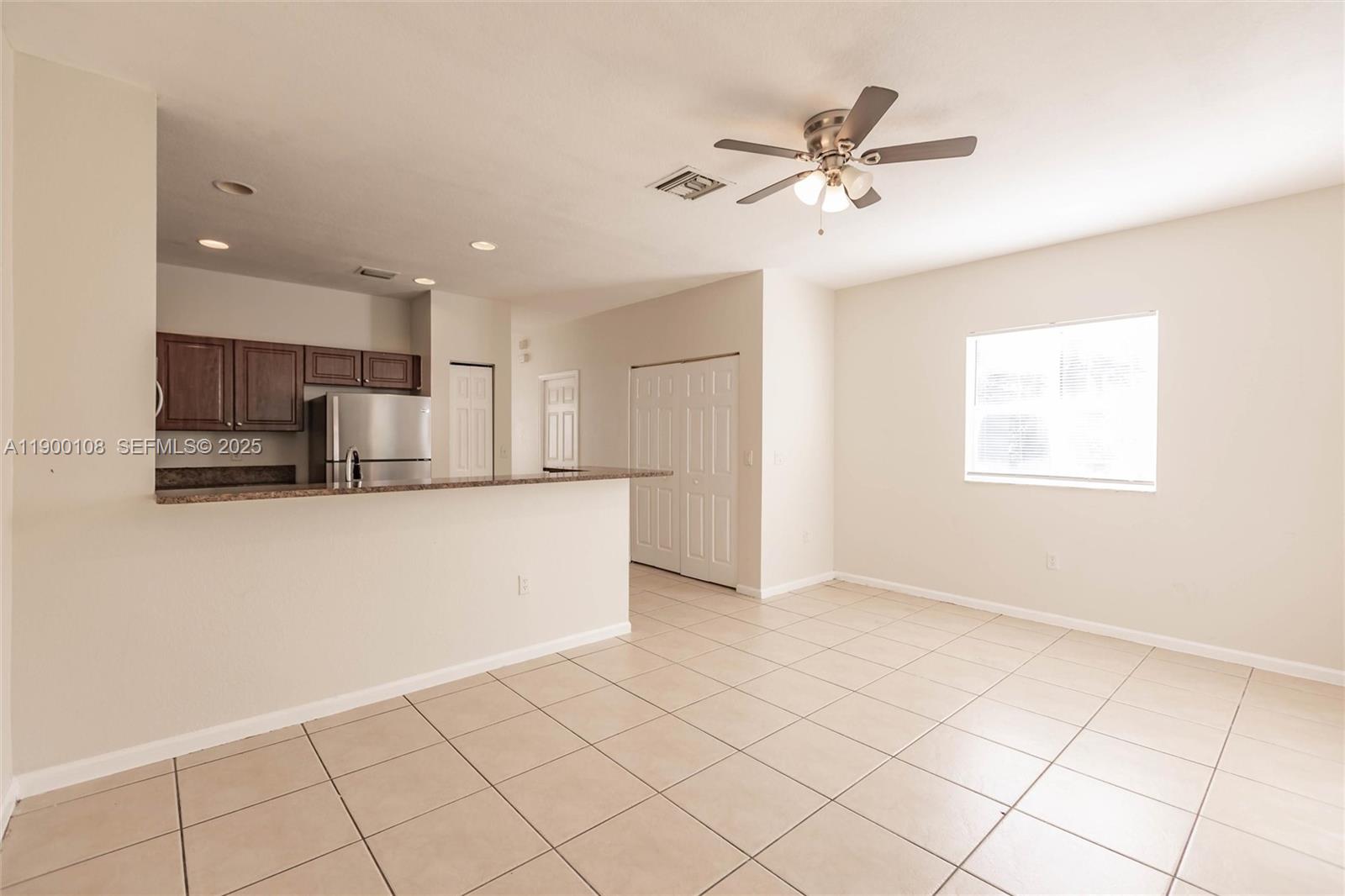 8297 Southwest 25th Court, Unit 101 Miramar, FL 33025 - Photo 13 of 42 a view of kitchen with stainless steel appliances cabinets and window