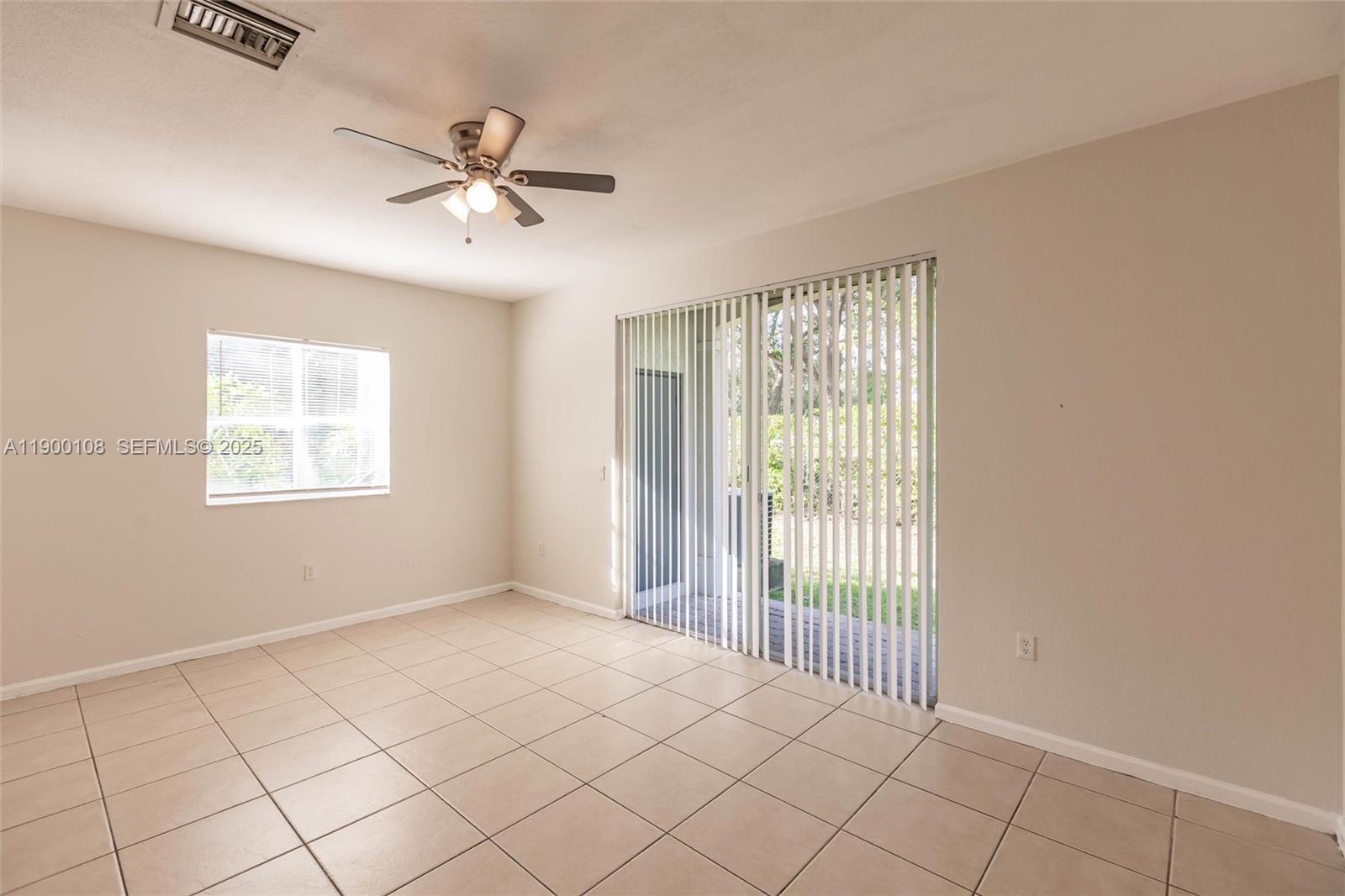 8297 Southwest 25th Court, Unit 101 Miramar, FL 33025 - Photo 14 of 42 a view of an empty room with a window