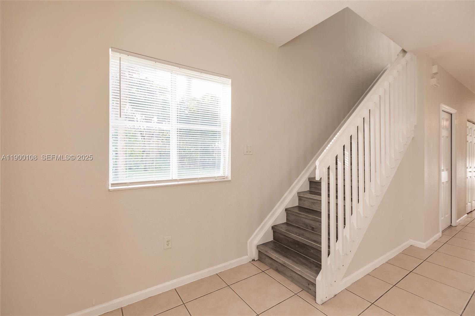 8297 Southwest 25th Court, Unit 101 Miramar, FL 33025 - Photo 16 of 42 a view of entryway with stairs