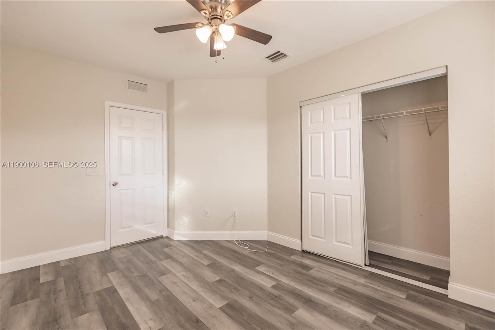8297 Southwest 25th Court, Unit 101 Miramar, FL 33025 - Photo 20 of 42 wooden floor in an empty room