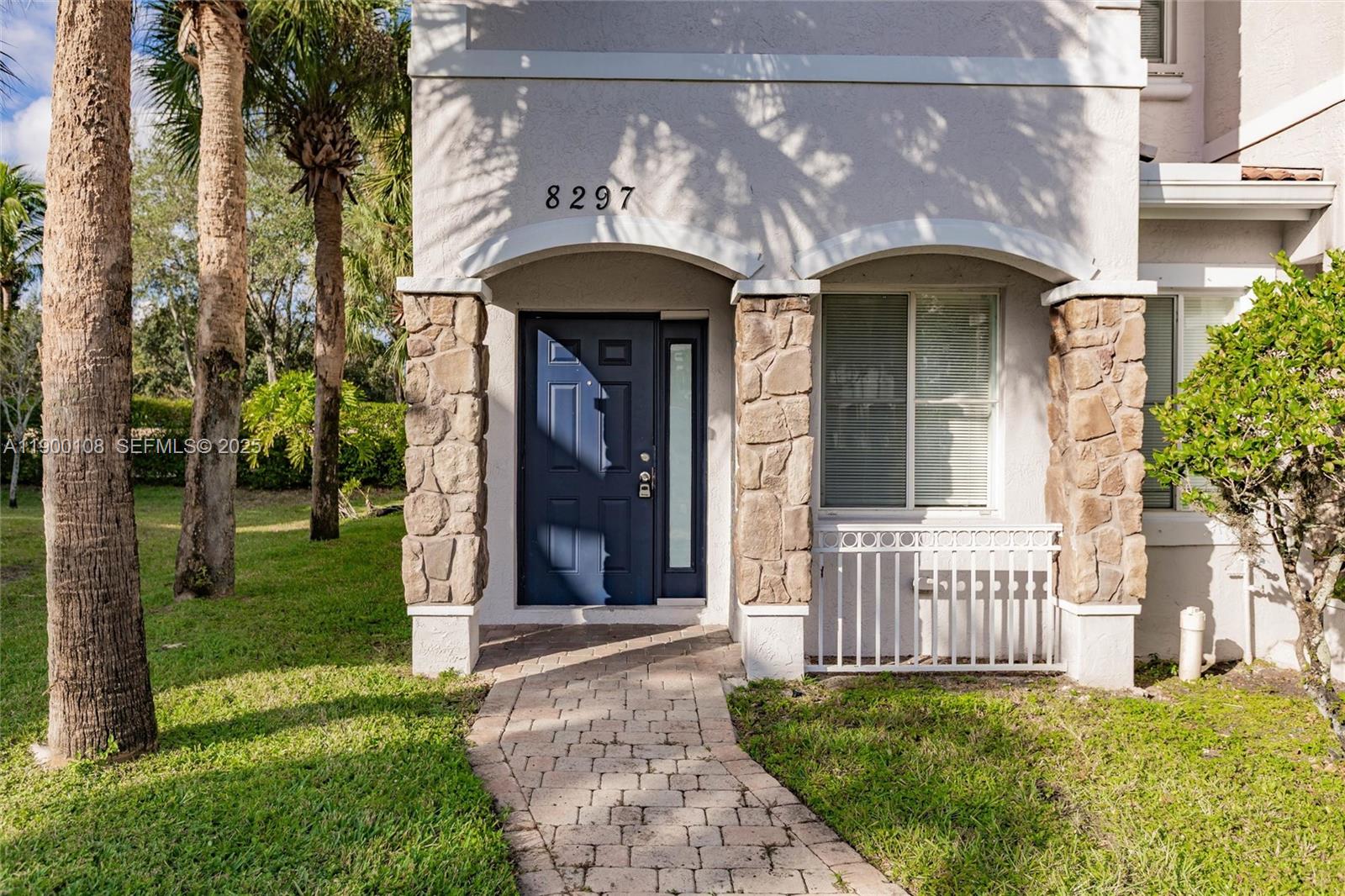 8297 Southwest 25th Court, Unit 101 Miramar, FL 33025 - Photo 2 of 42 a view of a house with a yard