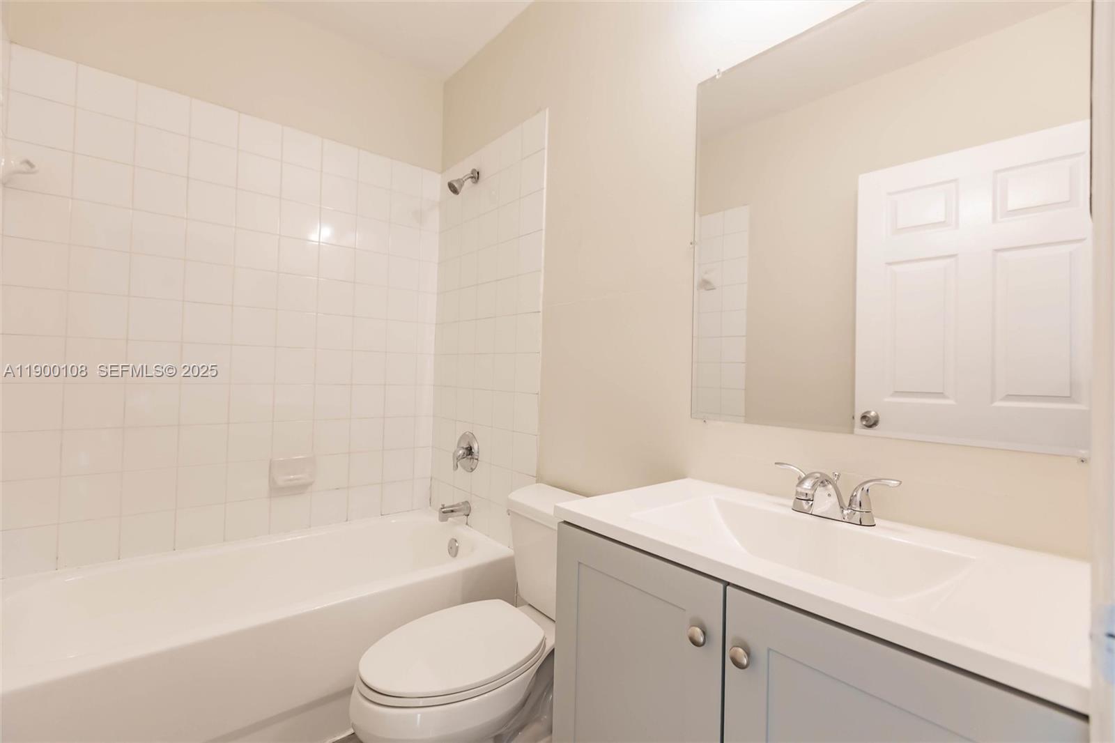 8297 Southwest 25th Court, Unit 101 Miramar, FL 33025 - Photo 22 of 42 a bathroom with a sink a toilet and a bathtub