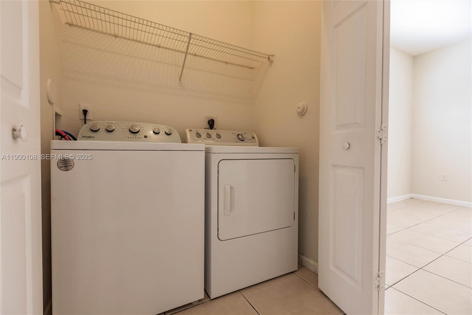 8297 Southwest 25th Court, Unit 101 Miramar, FL 33025 - Photo 30 of 42 a utility room with dryer and washer