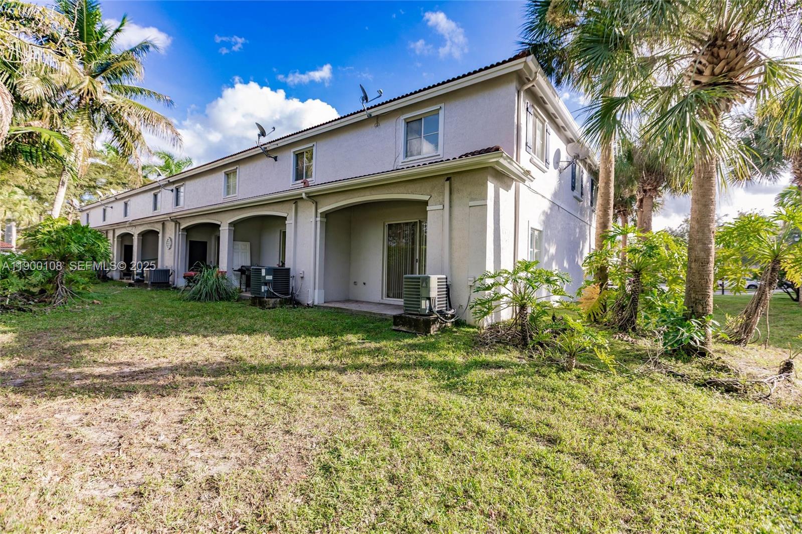 8297 Southwest 25th Court, Unit 101 Miramar, FL 33025 - Photo 32 of 42 a view of a house with a yard