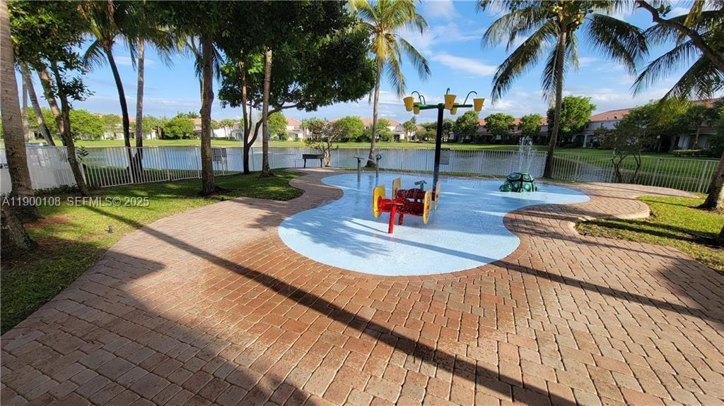 8297 Southwest 25th Court, Unit 101 Miramar, FL 33025 - Photo 40 of 42 a view of a backyard with swimming pool
