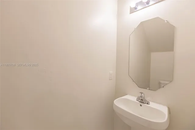 a kitchen with stainless steel appliances granite countertop a refrigerator a stove a sink and a microwave