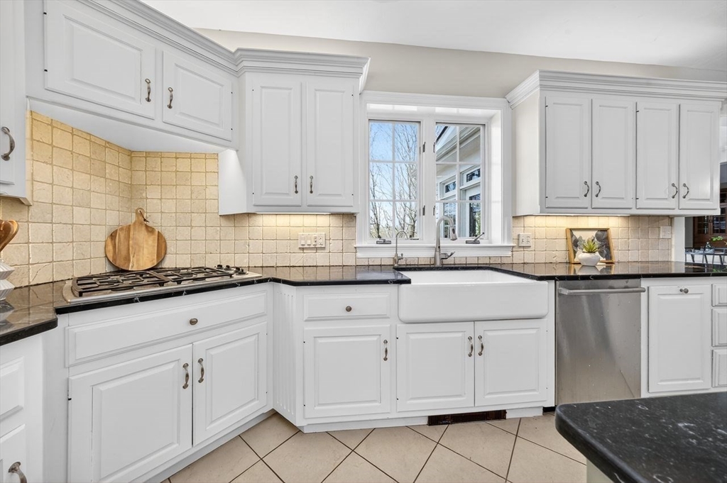 792 A Jerusalem Road Cohasset, MA 02025 - Photo 12 of 42 a kitchen with granite countertop white cabinets and white appliances