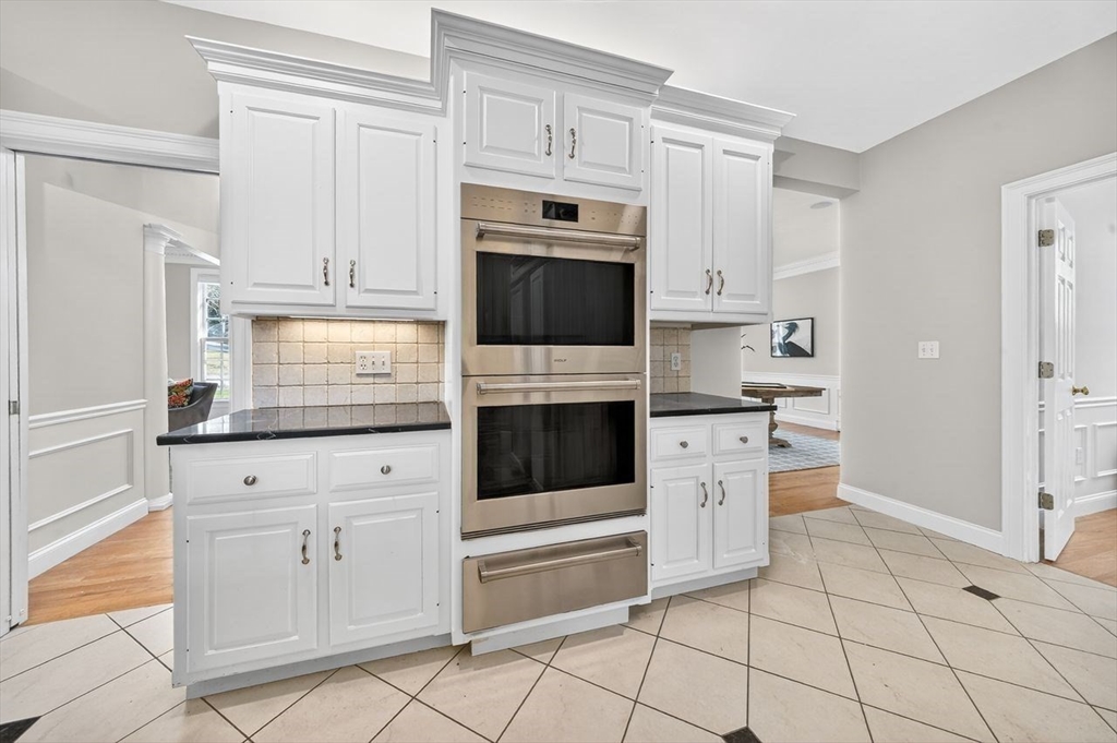 792 A Jerusalem Road Cohasset, MA 02025 - Photo 13 of 42 a kitchen with white cabinets and white appliances