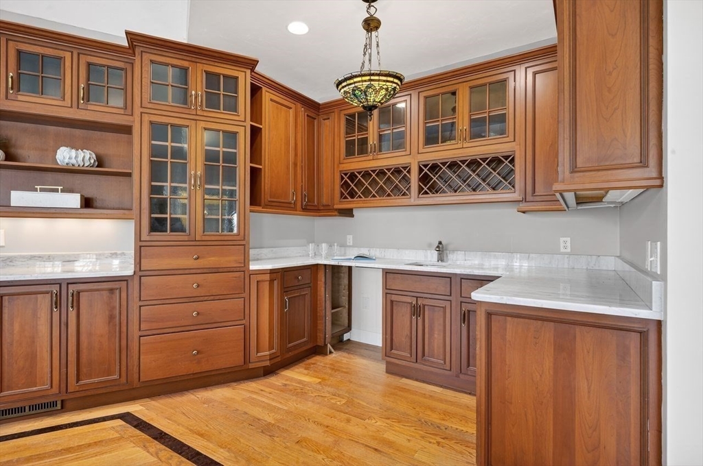 792 A Jerusalem Road Cohasset, MA 02025 - Photo 21 of 42 a kitchen with stainless steel appliances granite countertop a sink dishwasher stove and cabinets